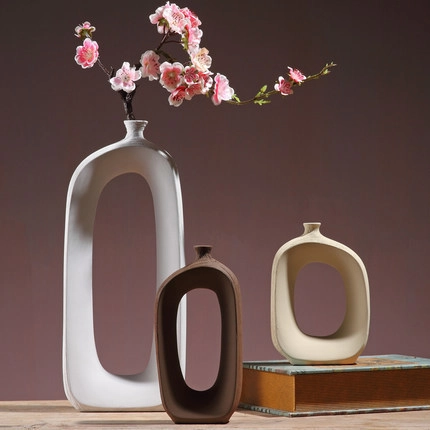 Jarrón De Cerámica Nórdico Arte Ovalado Hueco Decoración De Escritorio Soporte Para Flores De Cerámica Minimalista Moderno Y Ramas De Flores De Ciruelo Artificiales