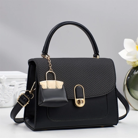 Women PU Leather Handbag Woven Flap Crossbody Bag With Metal Lock And Mini Charm Adjustable Strap Minimalist Elegant