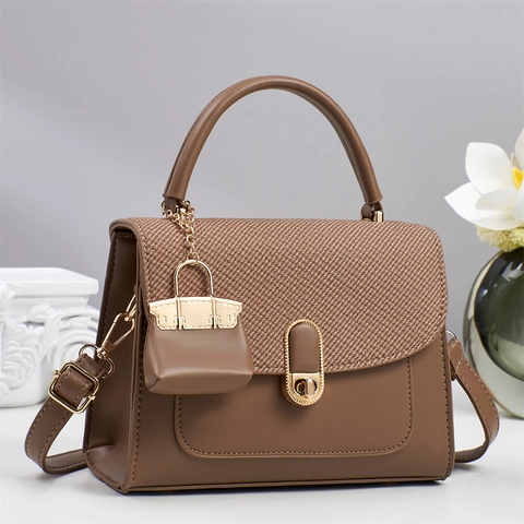 Women PU Leather Handbag Woven Flap Crossbody Bag With Metal Lock And Mini Charm Adjustable Strap Minimalist Elegant