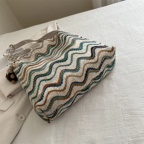 Large Capacity Knit Bucket Bag Women Slouchy Woven Wave Pattern Shoulder Bag With Wide Geometric Strap And Plush Pendant