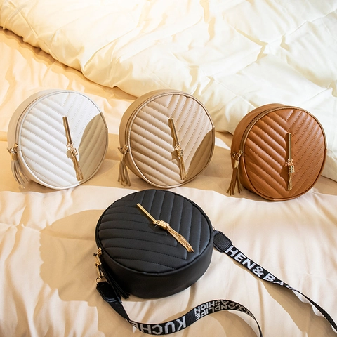 Women Round Crossbody Bag PU Leather V-Quilted Shoulder Bag With Gold Tassel And Wide Letter Print Strap