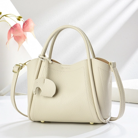 Einfarbige Damen Eimer Handtasche Lychee Muster PU Leder Mit Elefant Anhänger Crossbody Schultertasche Chic Minimalist