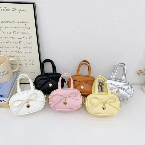 Kids Girls Mini PU Leather Crossbody Bag Sweet Bowknot Heart Pendant Handbag Solid Color Adjustable Strap