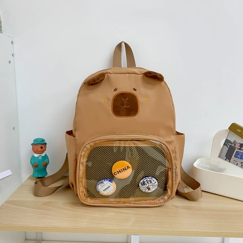 Mochila Infantil Linda Forma De Capibara Oso Nylon Transpirable Bolsa Escolar Kinder Con Bolsillo Transparente Y Insignias