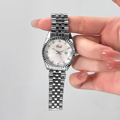 Montre Femme Quartz Élégante Bracelet Acier Inoxydable Lunette Cannelée Cadran Strass Calendrier Date Affaires Mode
