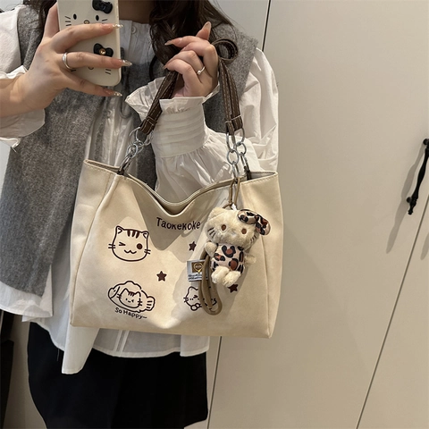Women Canvas Tote Bag Cream White Cartoon Cat Print Large Capacity Shoulder Bag Casual Commuter With Plush Pendant