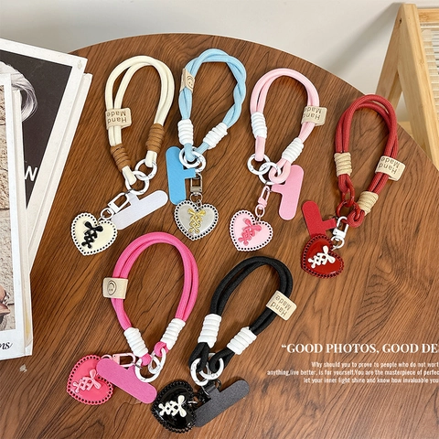 Telefon-Lanyard-Handschlaufe Geflochtenes Nylon Mit Herzanhänger Anti-Verlust-Handyhüllen-Haltelasche Handgefertigter Stil Für Frauen