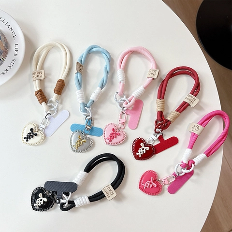 Telefon-Lanyard-Handschlaufe Geflochtenes Nylon Mit Herzanhänger Anti-Verlust-Handyhüllen-Haltelasche Handgefertigter Stil Für Frauen