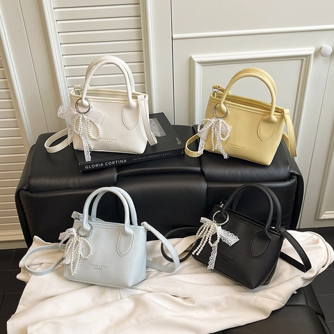 Women Minimalist PU Leather Bucket Bag Solid Color Litchi Grain Crossbody Bag With Artificial Pearl Lace Pendant Handbag