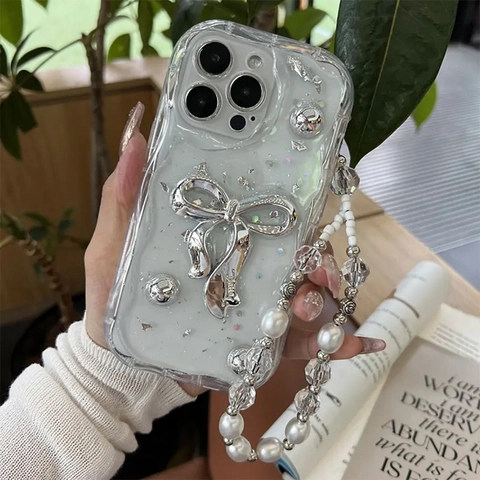 Custodia iPhone Bianco Crema Con Fiocco Argento E Cordino Di Perle TPU Antiurto Per Apple iPhone 16 17 Pro Max