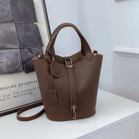 Borsa a Secchiello da Donna in Pelle PU con Trama a Buccia d'Arancia Retrò Borsa a Tracolla a Mano con Lucchetto e Ciondolo Smiley