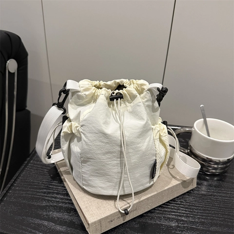 Casual Nylon Drawstring Bucket Bag For Women Minimalist Shoulder Crossbody Bag With Mesh Side Pockets Lightweight Commuter Handbag