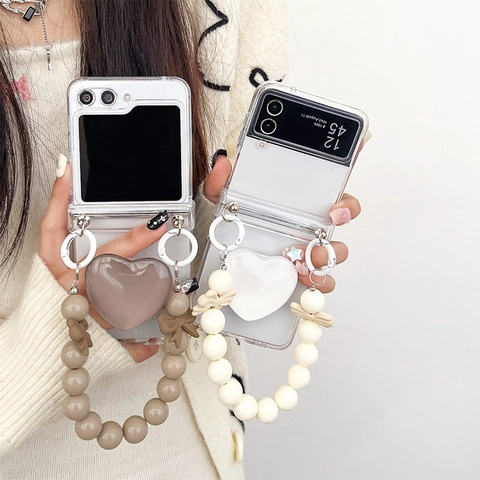 Transparent Folding Smartphone Case With 3D Heart Airbag Stand And Bow Bead Hand Chain Strap Shockproof Ins Style
