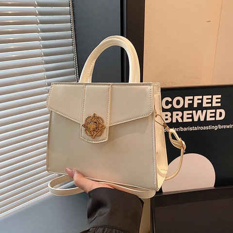 Damen PU Leder Handtasche Retro Goldene Blumenschnalle Schulter Umhängetasche Große Kapazität Trapez Mode