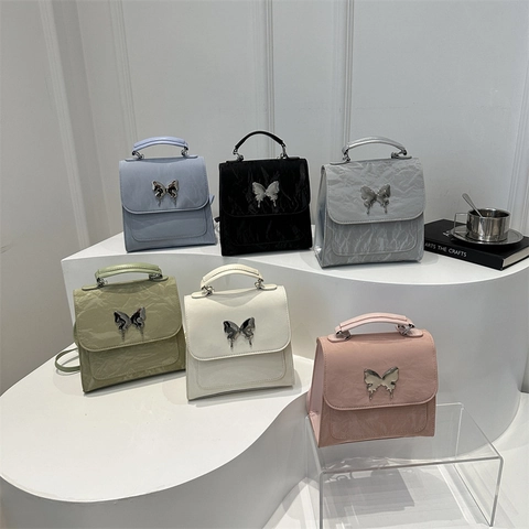 Mochila Pequeña De Moda Mujer Cuero PU Arrugado Con Hebilla Mariposa Metal Bolso De Hombro Estilo Streetwear