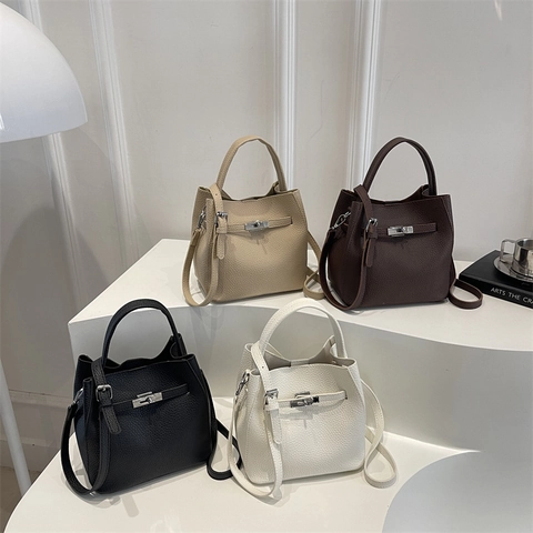 Schicke Eimer-Handtasche Aus PU-Leder Mit Litschi-Muster Silbernem Drehverschluss Verstellbarem Riemen Elegante Umhängetasche