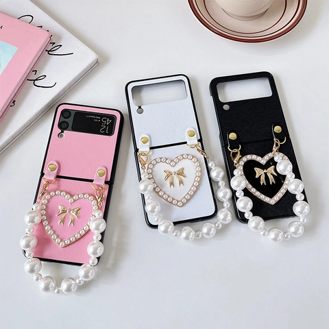 Coque De Téléphone Pliable Cuir PU Grain Croisé Cœur Poignée Künstliche Perle Nœud Doré Luxe Élégant Coque Protection