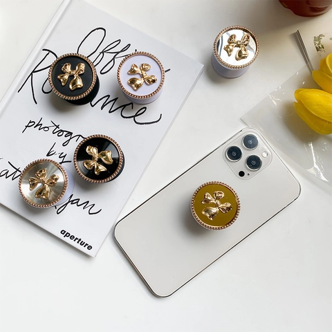 Support De Téléphone Élégant À Nœud Papillon Gaufré 3D Design Pliable Extensible Avec Finition Galvanisée Style Vintage