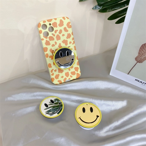 Uitschuifbare Telefoonhouder Grip Spiegeloppervlak Happy Face Ontwerp Lijm Ronde Standaard Ondersteuning Voor Mobiele Apparaten