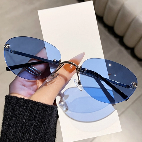 Occhiali Da Sole Ovali Senza Montatura Moda Montatura In Metallo Lenti PC Protezione UV400 Stile Retro Y2K Per Donne