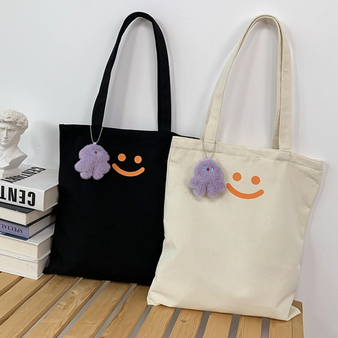 Dames Canvas Tas Smile Face Print Grote Capaciteit Schoudertas Met Pluche Hanger Studentenschool Handtas Eenvoudige Stijl
