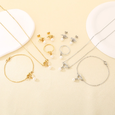 Ensemble de Bijoux Chic en Acier Inoxydable Nœud Perles Artificielles Pour Femmes Plaqué Or Argent Collier Bracelet Boucles d'Oreilles Bague