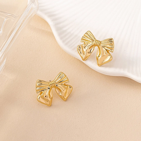 Elegant Bowknot Stud Earrings Zinc Alloy Textured Metallic Ribbon Style Accessory For Women Fashionable