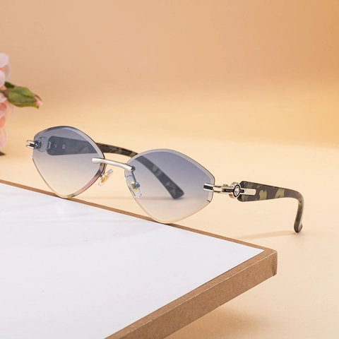 Lunettes de Soleil Femme Tendance Oeil de Chat Sans Monture Mode Strass UV400 Verres Dégradés Monture Métal Luxe Fête