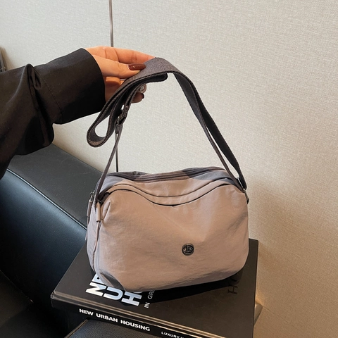 Women Nylon Dumpling Crossbody Bag Trendy Casual Lightweight Shoulder Bag With Adjustable Wide Strap Round Metal Logo