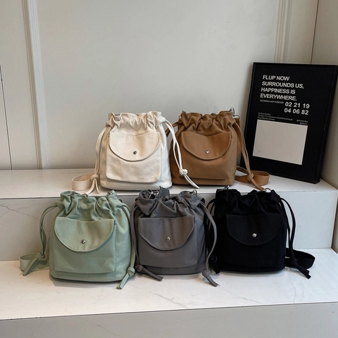 Minimalist Canvas Drawstring Bucket Bag For Women Casual Crossbody Shoulder Handbag With Front Flap Pocket Adjustable Wide Strap