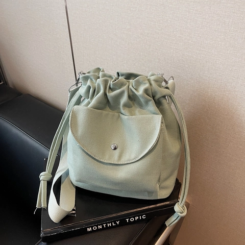 Minimalist Canvas Drawstring Bucket Bag For Women Casual Crossbody Shoulder Handbag With Front Flap Pocket Adjustable Wide Strap