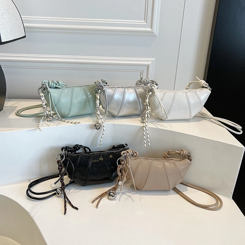 Women Croissant Shoulder Bag Glossy PU Leather Quilted Crescent Crossbody Bag With Knot Strap And Metallic Pendant