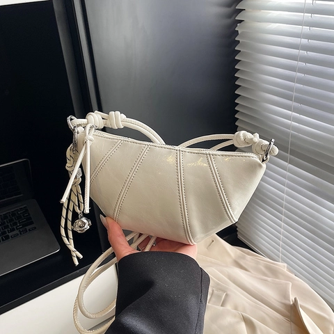 Women Croissant Shoulder Bag Glossy PU Leather Quilted Crescent Crossbody Bag With Knot Strap And Metallic Pendant