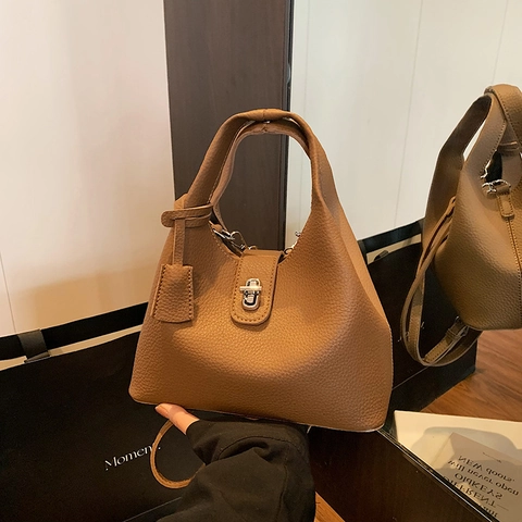 Eimer Tasche Lychee Narbung PU Leder Damen Handtasche Mit Metall Drehverschluss Abnehmbarem Schultergurt Nische Design
