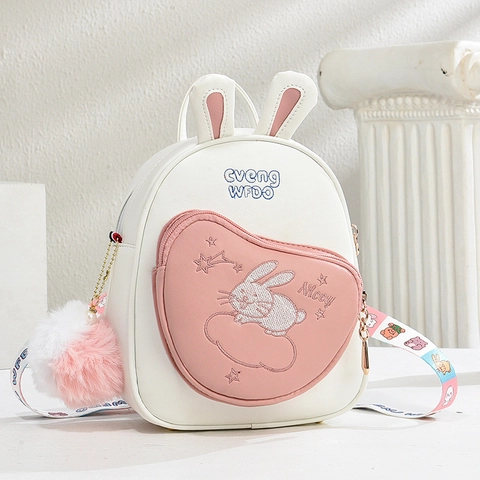 Süßer Mini Rucksack Mit Hasenohren Für Mädchen PU Leder Cartoon Hasen Stickerei Kleine Umhängetasche Mit Bommel Anhänger Bedrucktem Gurt