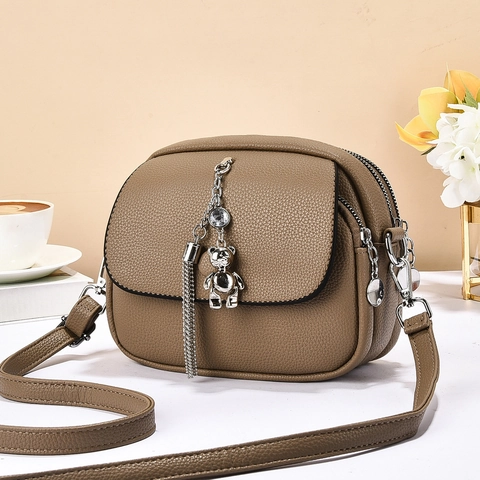 Women Crossbody Bag Lychee Texture PU Leather Multiple Zipper Compartments Bear Pendant Metal Tassel Adjustable Strap