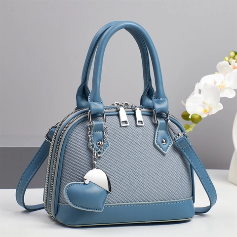 Damen Dome Bag PU Leder Gewebte Struktur Reißverschluss Handtasche Umhängetasche Mit Herzanhänger Elegant
