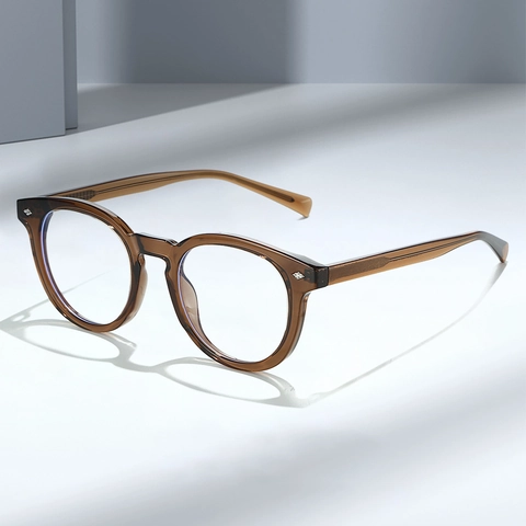 Occhiali Anti Luce Blu Montatura Rotonda TR90 Decorazione Rivetti Moda Leggera Unisex