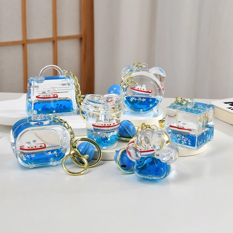 Portachiavi Barca A Vela Galleggiante Acrilico Liquido Sabbie Mobili Mare Blu Glitter Fascino Borsa Auto Stile Nautico Regalo