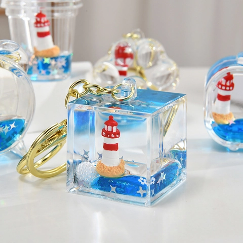 Kreativer Acryl Schlüsselanhänger Blau Treibsand Schwimmender Leuchtturm Segelboot Tasche Anhänger Nautischer Stil Ozean Thema Geschenk