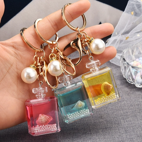 Llavero De Botella De Perfume Acrílico Líquido Arena Movediza Colgante De Bolsa Con Perla Artificial Y Concha Tema Océano