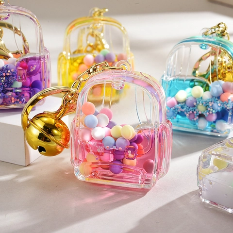Mignon Porte-clés de Sac d'école en Acrylique Avec Bonbons Colorés Sable Mouvant Liquide Pendentif Cloche Dorée pour Filles
