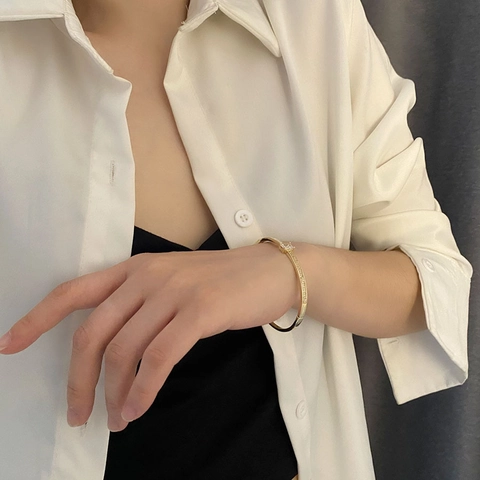 Gold Plated Copper Bangle For Women With Rectangular Cubic Zirconia And White Enamel Inlay Elegant Asymmetrical Jewelry