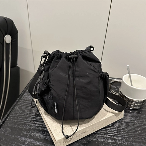 Casual Nylon Drawstring Bucket Bag For Women Minimalist Shoulder Crossbody Bag With Mesh Side Pockets Lightweight Commuter Handbag