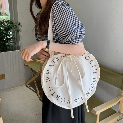 Runde Canvas Schultertasche Große Kapazität Kreisförmiger Buchstabendruck Kordelzug Schleife Lässige Koreanische Tragetasche