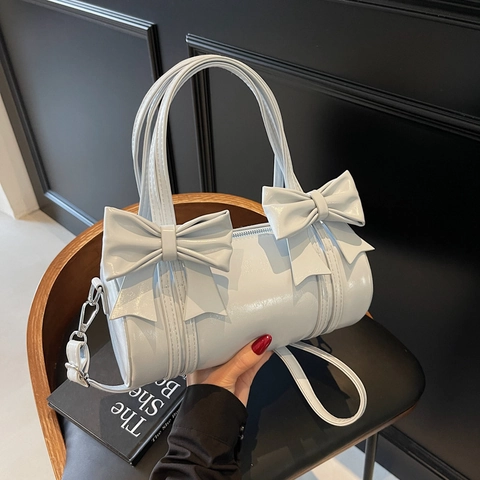 Damen Schleife Tonneau Tasche Glänzendes PU Leder Zylinder Umhängetasche Doppelgriffe Abnehmbarer Gurt Süßer Stil