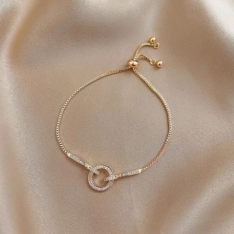Elegant Gold Plated Copper Bracelet With Zircon Micro Paved Intertwined Rings Adjustable Bolo Clasp For Women