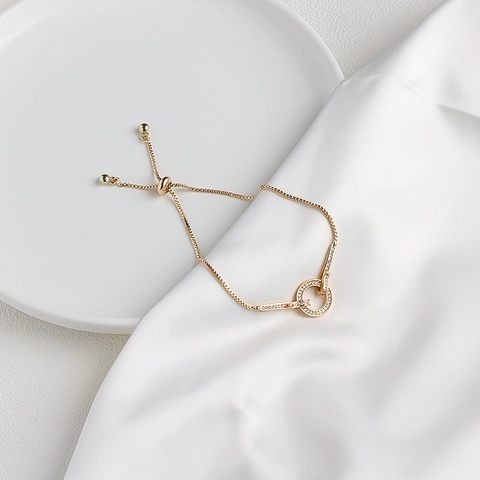 Elegant Gold Plated Copper Bracelet With Zircon Micro Paved Intertwined Rings Adjustable Bolo Clasp For Women