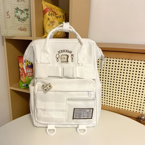 Sac À Dos Nylon Grande Capacité Multi Poches Style Japonais Écusson Pain Mignon Sac D'École Pour Femmes Étudiants Imperméable