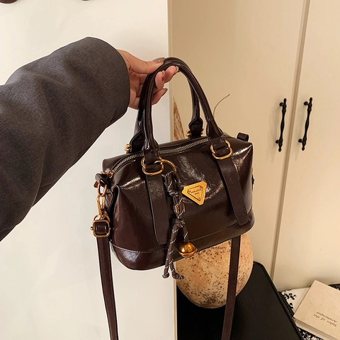 Vintage Women PU Leather Boston Shoulder Bag Retro Glossy Handbag With Triangle Plate And Bell Charm Crossbody Bag For Work